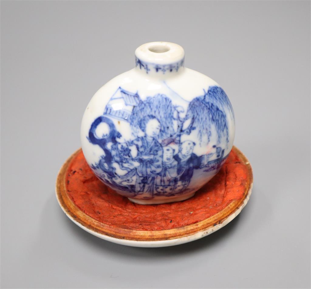 A 19th century Chinese blue and white snuff bottle and a similar dish, diameter 9cm